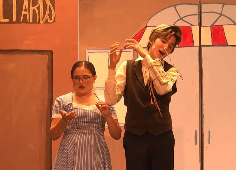 Tommy Djilas and Zaneeta Shinn look at Tommy's latest invention.